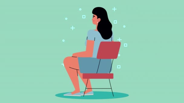 Young woman seated in chair — Stock Video