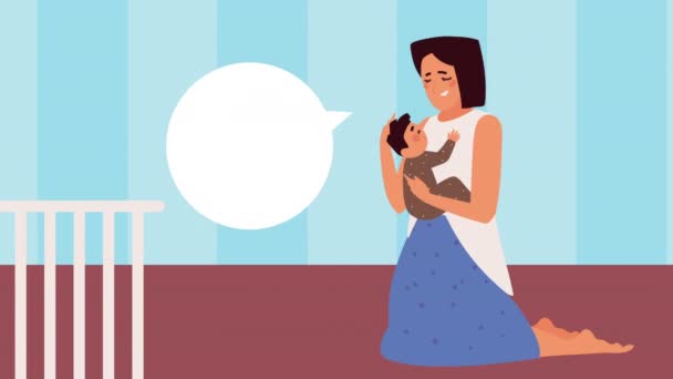 Mother holding baby kneeling speaking — стоковое видео