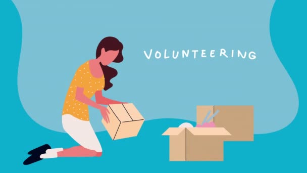 Voluntariado letras con la mujer voluntaria y cajas — Vídeo de stock