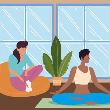 Evde rahat kadınlar var ve yoga yapıyorlar.