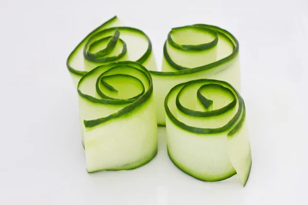 Cucumbers rolls on a white surface — Stock Photo, Image