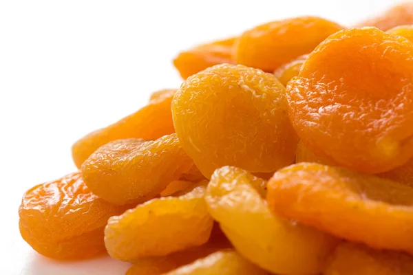Dried apricots on white surface — Stock Photo, Image