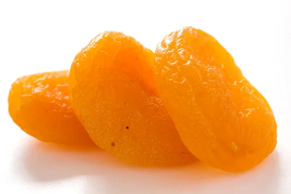 Three dried apricots — Stock Photo, Image