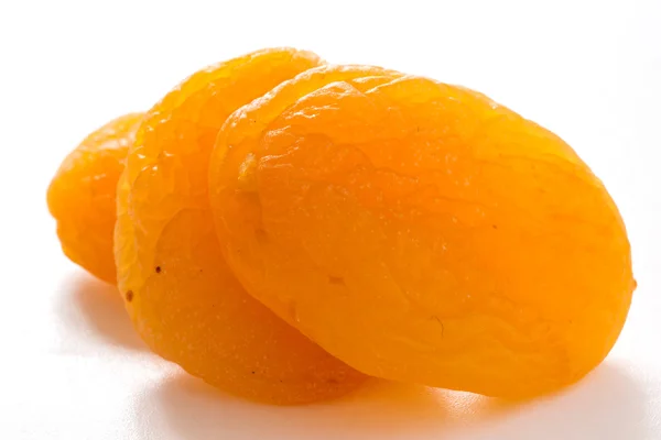 Three dried apricots — Stock Photo, Image