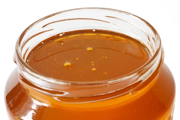 Detail of open honey jar — Stock Photo, Image