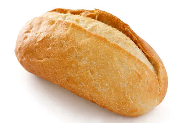 Single crusty mini baguette on white surface — Stock Photo, Image
