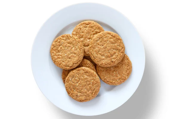 Plate of crispy golden oat biscuits — Stock Photo, Image