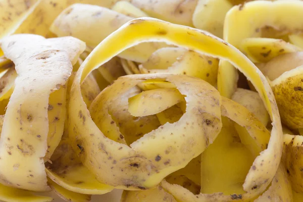 신선한 감자 스킨 또는 껍질 배경 — 스톡 사진