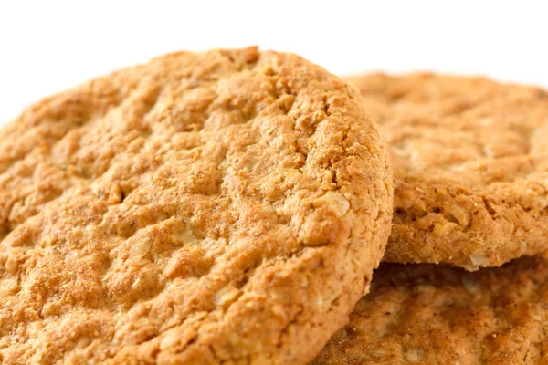 Three crispy golden oat biscuits — Stock Photo, Image