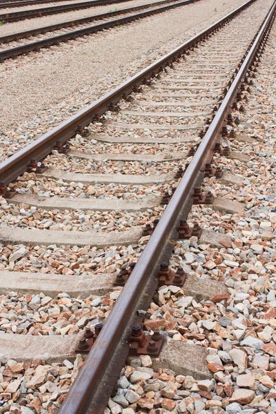 Newly laid train tracks on concrete ballasts — Stock Photo, Image