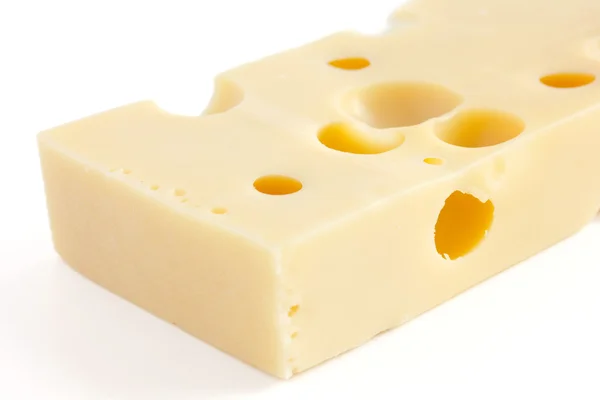 Block of swiss type cheese on white — Stock Photo, Image