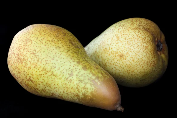 Two whole pears isolated on black. — Stock Photo, Image
