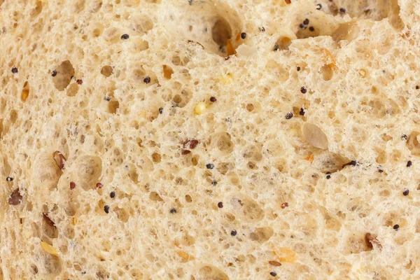 Rebanada de pan integral multi-semilla detalle con mucha textura — Foto de Stock