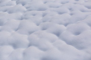Soft snow in a field texture, winter texture
