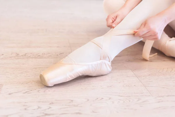 Ballerina Sitting Floor Tying Her Ballet Shoes Close View — ストック写真