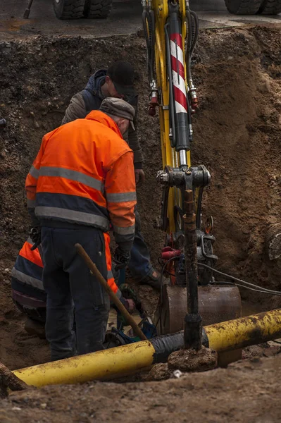 Repairing water pipes. Workers attending to the city water supply repairs.