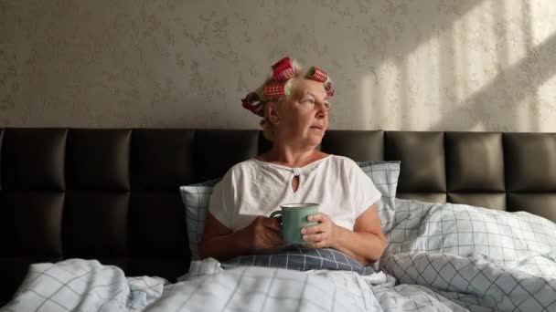 Attractive 50S Woman Sitting Bed Morning Drinking Coffee — Stock Video