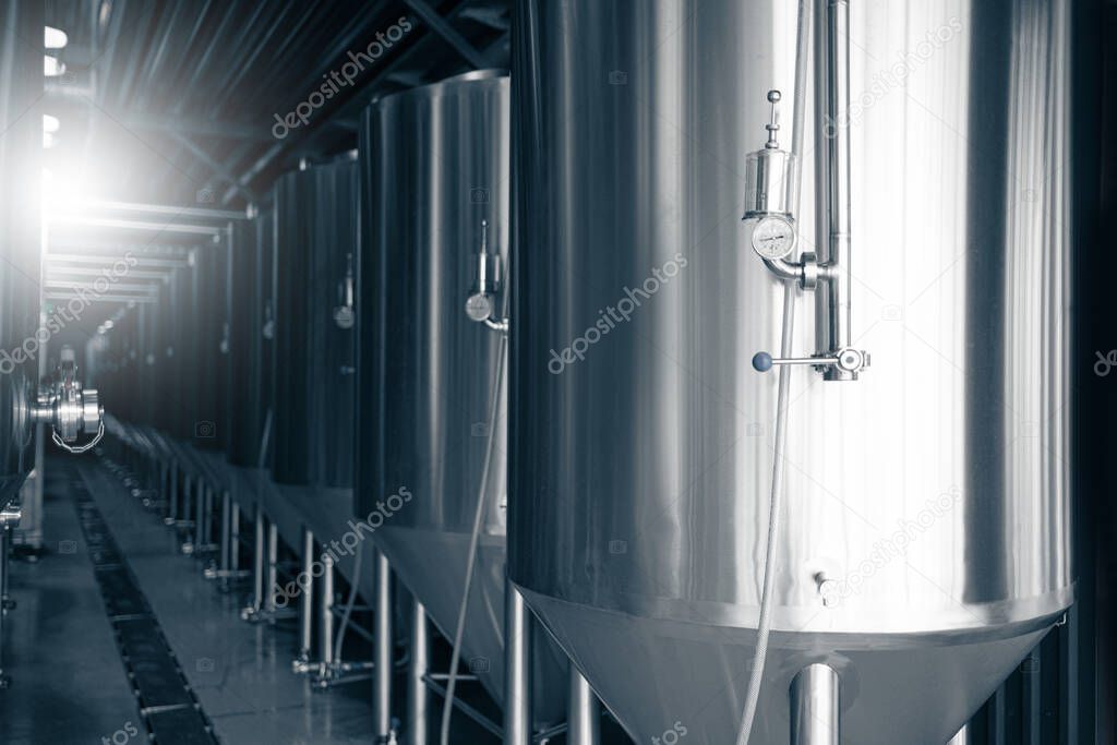 Manometers on steel cylinder storages or vats or tanks on beer and a cider production plant, industry machine equipment