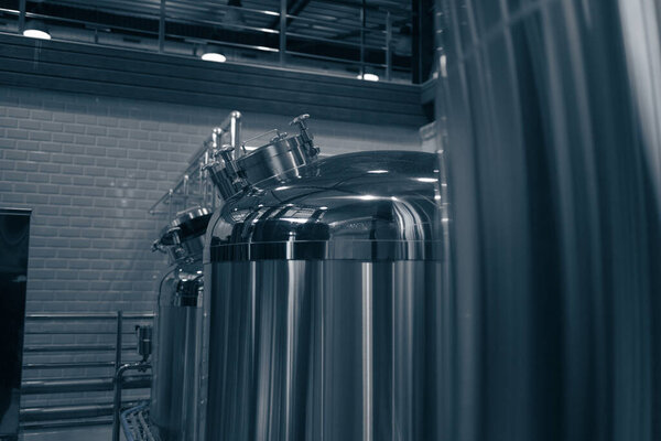 Modern brewery production steel tanks and pipes, machinery tools and vats, beer production