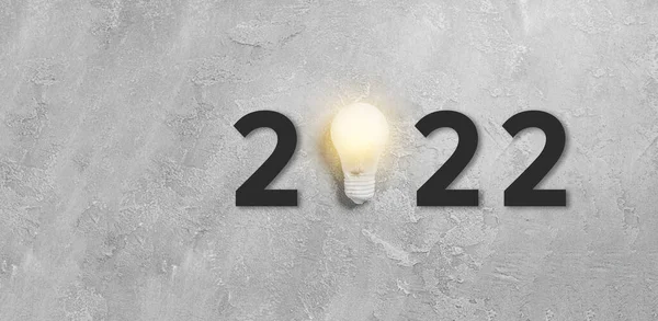 Nytt 2022 Idé Hängande Glödlampa Grå Betong Bakgrund Lyckad Affärsidé — Stockfoto