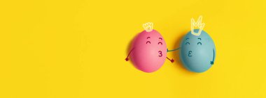 Couple in love king eggs on a yellow horizontal background. Natural healthy organic food. Top view, flat lay, copy space. Valentines day background. Horizontal poster, flyer, greeting card