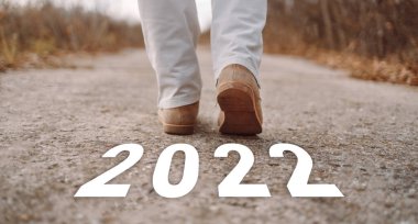Female feet in a boots at the start. New start of the new year 2023, goals and plans for the next year