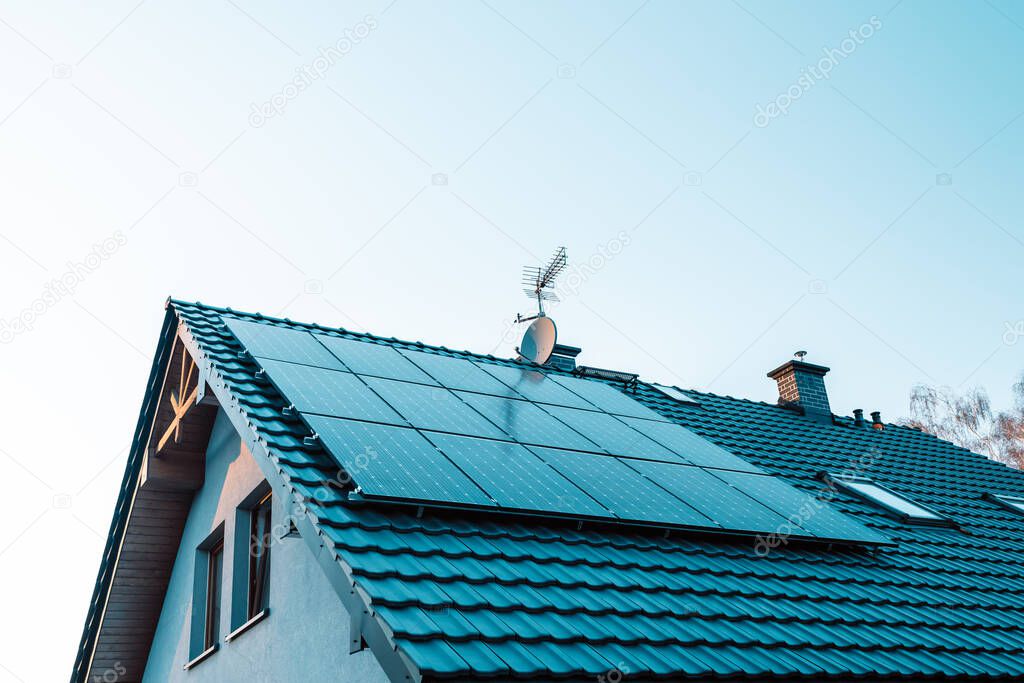 Solar panels on the roof of the modern house,harvesting renewable energy with solar cell panels