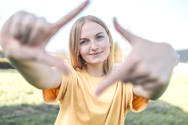 Close up of woman hands making frame gesture at camera. Future planning concept