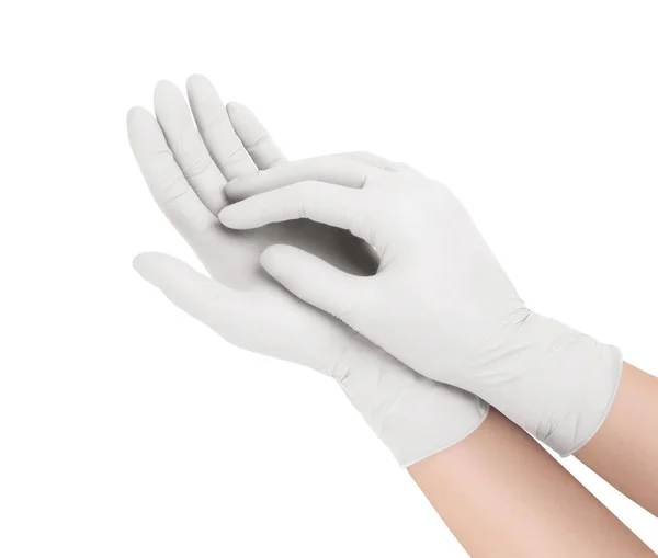 Rękawiczki. Dwie białe rękawice chirurgiczne odizolowane na białym tle dłońmi. Wytwarzanie gumowych rękawic, ludzka ręka nosi lateksową rękawicę. Lekarz lub pielęgniarka zakładający rękawice ochronne — Zdjęcie stockowe