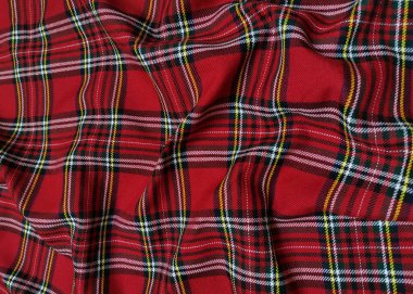 Kırmızı tartan yünlü okul üniforması kumaşı. İskoç klasik dikişsiz flanel kumaşı. Noel arkaplanı ya da duvar kağıdı için geleneksel dalga deseni. Siyah, Yeşil, Kırmızı ve Beyaz Damalı
