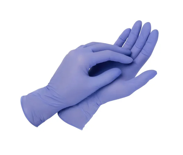 Lékařské rukavice. Dvě modré chirurgické rukavice izolované na bílém pozadí s rukama. Výroba gumových rukavic, lidská ruka má latexovou rukavici. Doktor nebo zdravotní sestra si nasazují ochranné rukavice — Stock fotografie