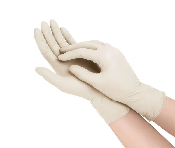 Sarung tangan medis. Dua sarung tangan bedah putih diisolasi dengan latar belakang putih dengan tangan. Karet sarung tangan manufaktur, tangan manusia mengenakan sarung tangan lateks. Dokter atau perawat memakai sarung tangan pelindung — Stok Foto