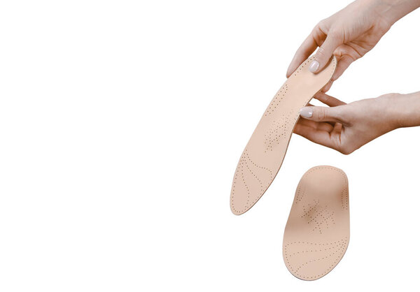 Orthopedic insole isolated on a white background. Medical insoles. Treatment and prevention of flat feet and foot diseases. Foot care, feet comfort. Wear comfortable shoes. Flat Feet Correction