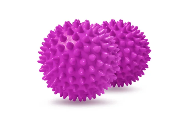 Dos bolas de masaje espinosas rosadas aisladas en blanco. Concepto de fisioterapia o fitness. Primer plano de una bola de goma colorida para dientes de perro sobre un fondo de color blanco. Modelo de virus Corona —  Fotos de Stock