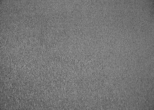 Grey indoor office carpet texture. High resolution seamless monochrome wool fabric background. Interior material background top view. Short pile carpet. Blank generic microfiber textile texture — Fotografia de Stock