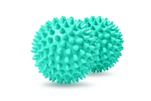 Beyaza izole edilmiş iki yeşil dikenli masaj topu. Fizyoterapi ya da uygunluk kavramı. Beyaz arkaplandaki köpek dişleri için renkli lastik topun yakın çekimi. Corona virüs modeli — Stok fotoğraf