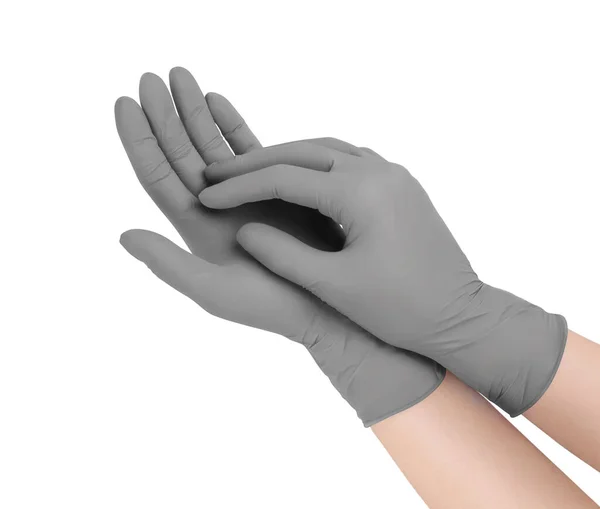 Medizinische Handschuhe. Zwei graue OP-Handschuhe isoliert auf weißem Hintergrund mit Händen. Gummihandschuhherstellung, menschliche Hand trägt einen Latex-Handschuh. Arzt oder Krankenschwester ziehen Schutzhandschuhe an — Stockfoto