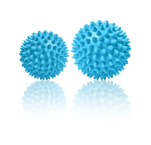 Twee blauwe stekelige massageballen geïsoleerd op wit. Concept van fysiotherapie of fitness. Close-up van een kleurrijke rubberen bal voor hond tanden op een witte achtergrond. Corona virus model. Sneeuwvlok — Stockfoto