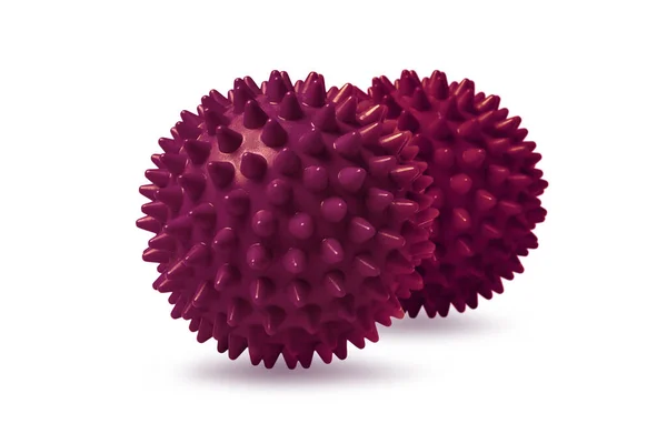 Twee rode stekelige massageballen geïsoleerd op wit. Concept van fysiotherapie of fitness. Close-up van een kleurrijke rubberen bal voor hond tanden op een witte achtergrond. Corona virus model — Stockfoto