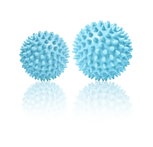 Dos bolas de masaje espinosas azules aisladas en blanco. Concepto de fisioterapia o fitness. Primer plano de una bola de goma colorida para dientes de perro sobre un fondo de color blanco. Modelo de virus Corona. Copo de nieve —  Fotos de Stock