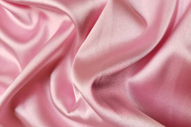 Pembe buruşuk ya da dalgalı kumaş dokusu arka planı. Soyut keten kumaş yumuşak dalgalar. İpek atlası ya da streç Jacquard. Pürüzsüz lüks kumaş dokusu. Pankart veya reklam kavramı