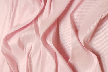 Pembe buruşuk ya da dalgalı kumaş dokusu arka planı. Soyut keten kumaş yumuşak dalgalar. İpek atlası ya da streç Jacquard. Pürüzsüz lüks kumaş dokusu. Pankart veya reklam kavramı