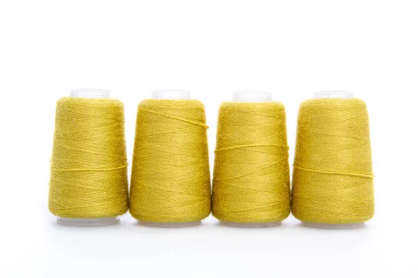 Yellow spool of thread isolated on white background. Skein of woolen threads. Yarn for knitting. Materials for sewing machine. Coil — Stock Photo, Image