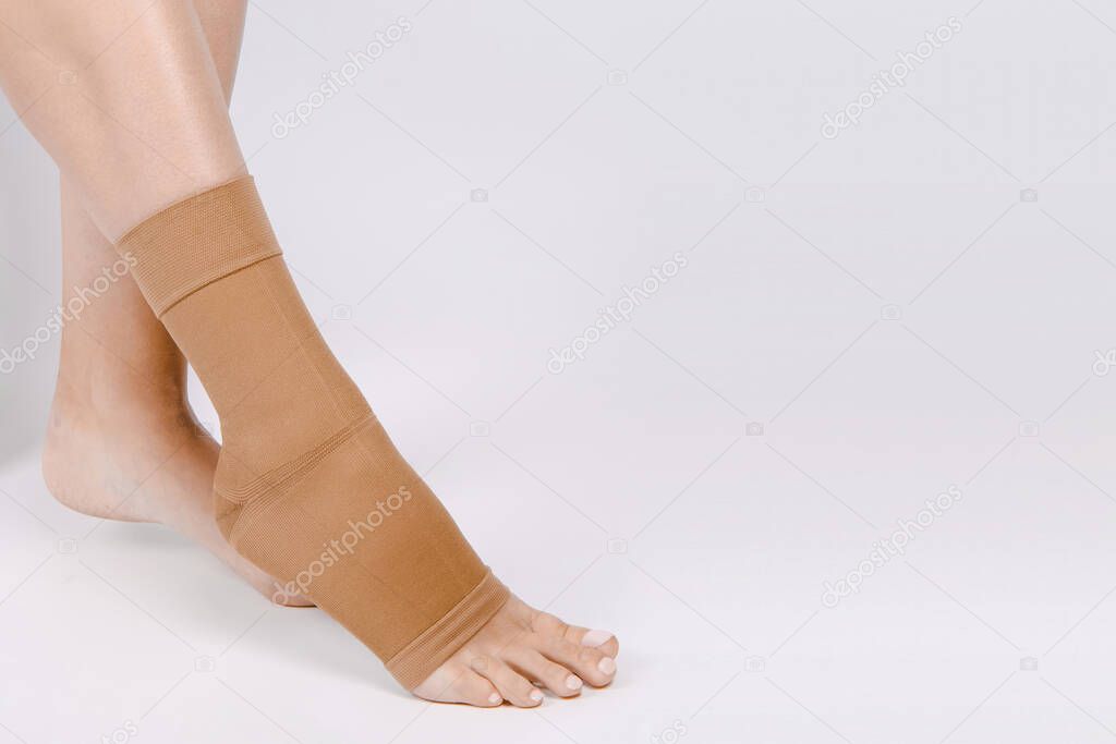 Orthopedic Ankle Brace. Medical Ankle Bandage. Medical Ankle Support Strap Adjustable Wrap Bandage Brace foot Pain Relief Sport. Leg Brace isolated on white background. Trauma Ankle orthosis. Injury