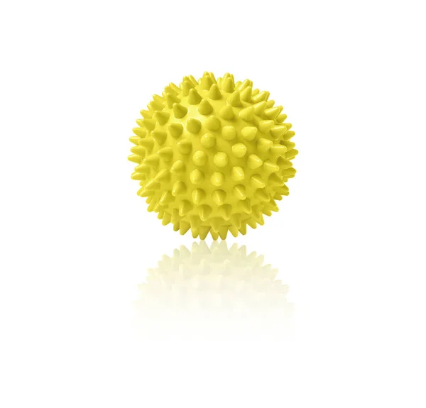 Yellow plastic spiny massage ball isolated on white. Concept of physiotherapy or fitness. Closeup of a colorful rubber ball for dog teeth on a white color background. Corona virus model — Stock Photo, Image