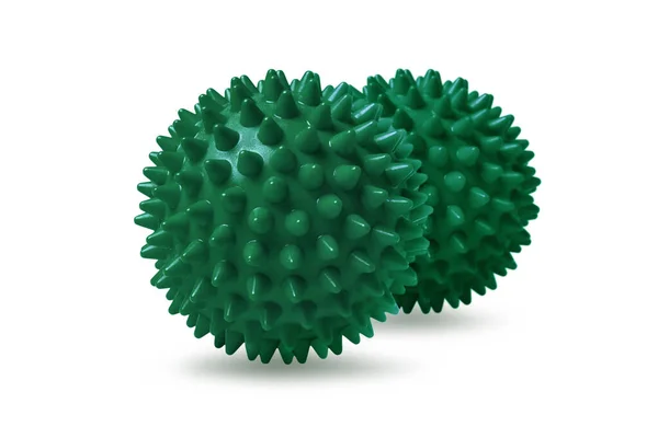 Two green spiny massage balls isolated on white. Concept of physiotherapy or fitness. Closeup of a colorful rubber ball for dog teeth on a white color background. Corona virus model — Stock Photo, Image