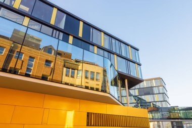 Aachen, NRW, Germany - October 09, 2021: modern building of AachenMnchener insurance at evening. AachenMnchener is part of the Generali AG, the second largest direct insurance company in Germany