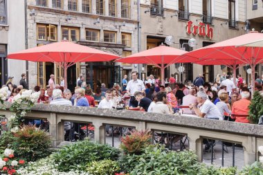Cologne, NRW, Germany - July 30, 2022: beer garden of the Cologne Frh brewery with unidentified people. It is a private brewery for top-fermented beer called Klsch