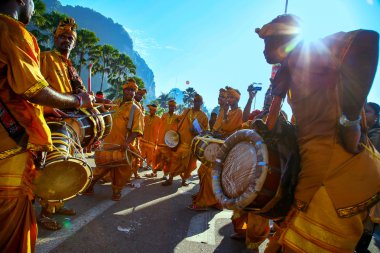 KUALA LUMPUR - JANUARY 27: Urumi melam drums brigade accompany the Hindu devotees in their procession to the Batu Caves temple on January 27, 2013 at the Thaipusam festival in Kuala Lumpur, Malaysia. clipart