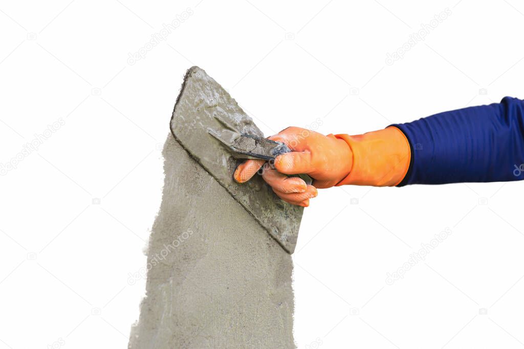 Plastering concrete to create industrial worker wall background with plastering tools